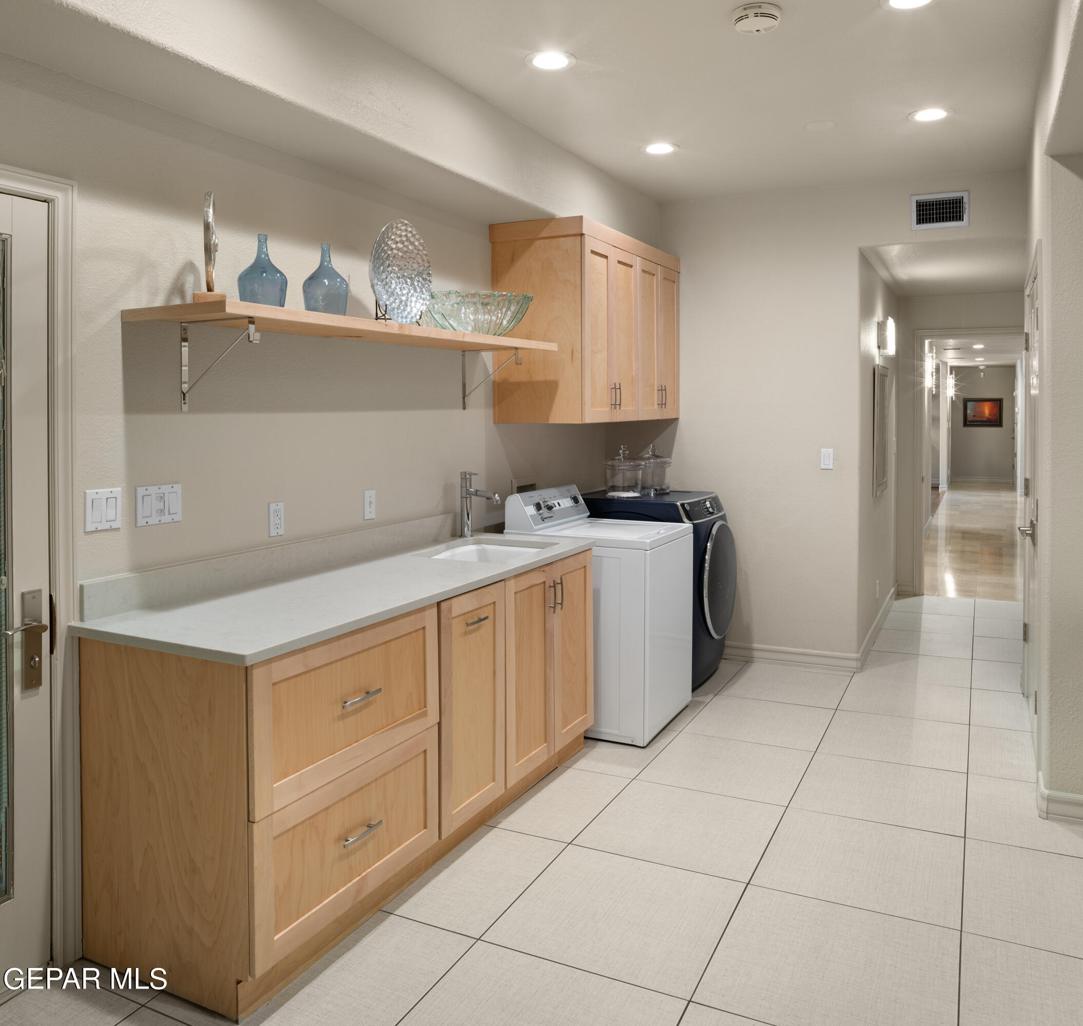 813 Rosinante Road El Paso, TX 79922 - Photo 33 of 67 a kitchen with a sink a stove and cabinets