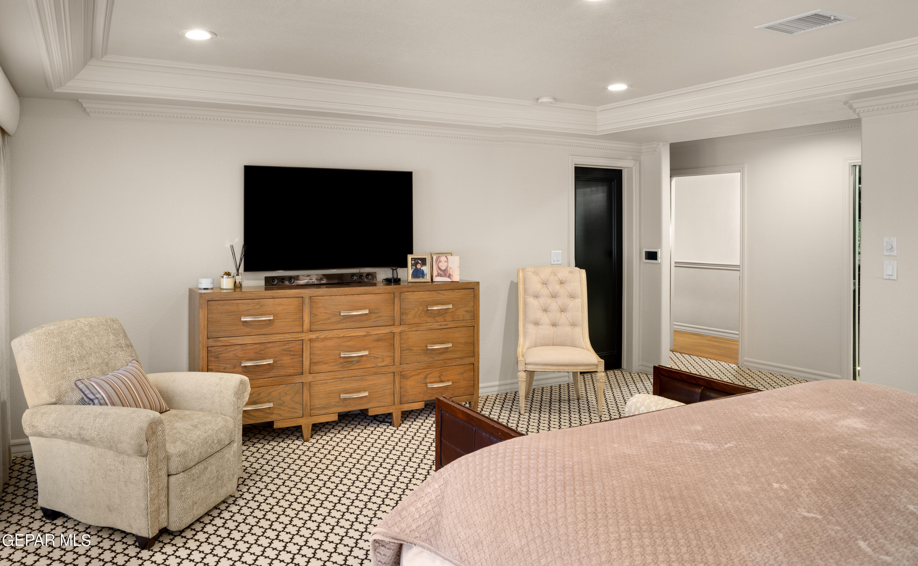 813 Rosinante Road El Paso, TX 79922 - Photo 45 of 67 a bedroom with a bed and a flat screen tv