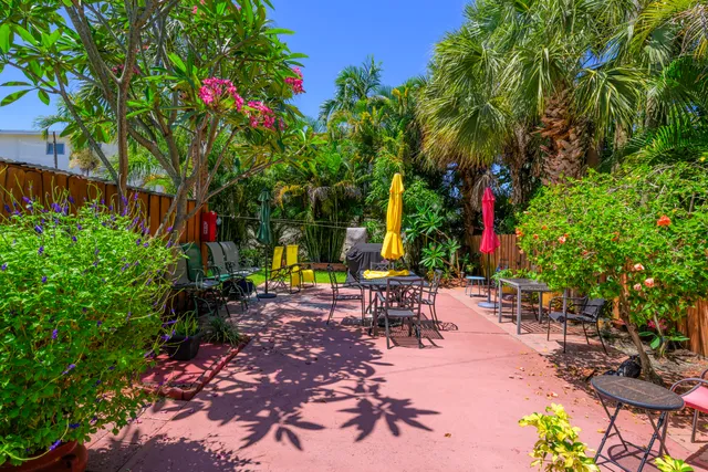 a view of a backyard with sitting area