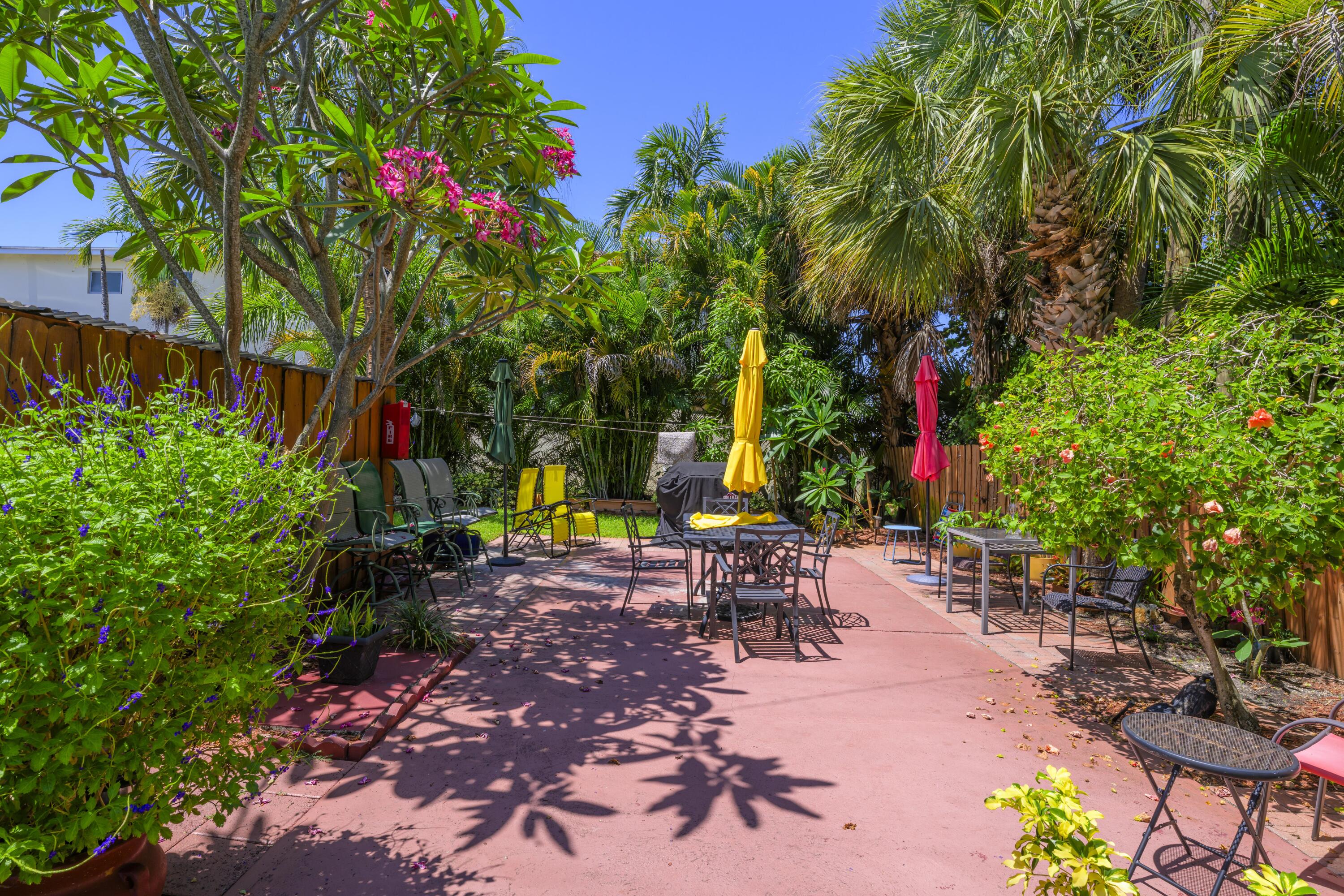 302 Lake Osborne Drive, Unit 4 Lake Worth Beach, FL 33461 - Photo 3 of 10 a view of a backyard with sitting area
