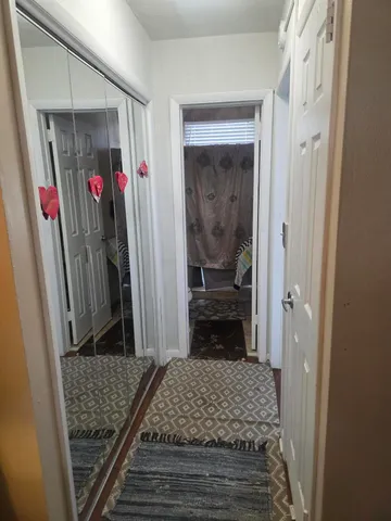 a bedroom with a bed and a walk in closet