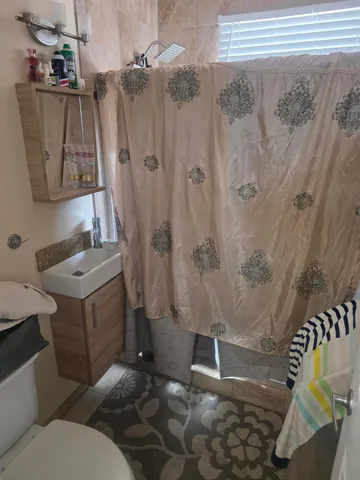 a bathroom with a sink and toilet