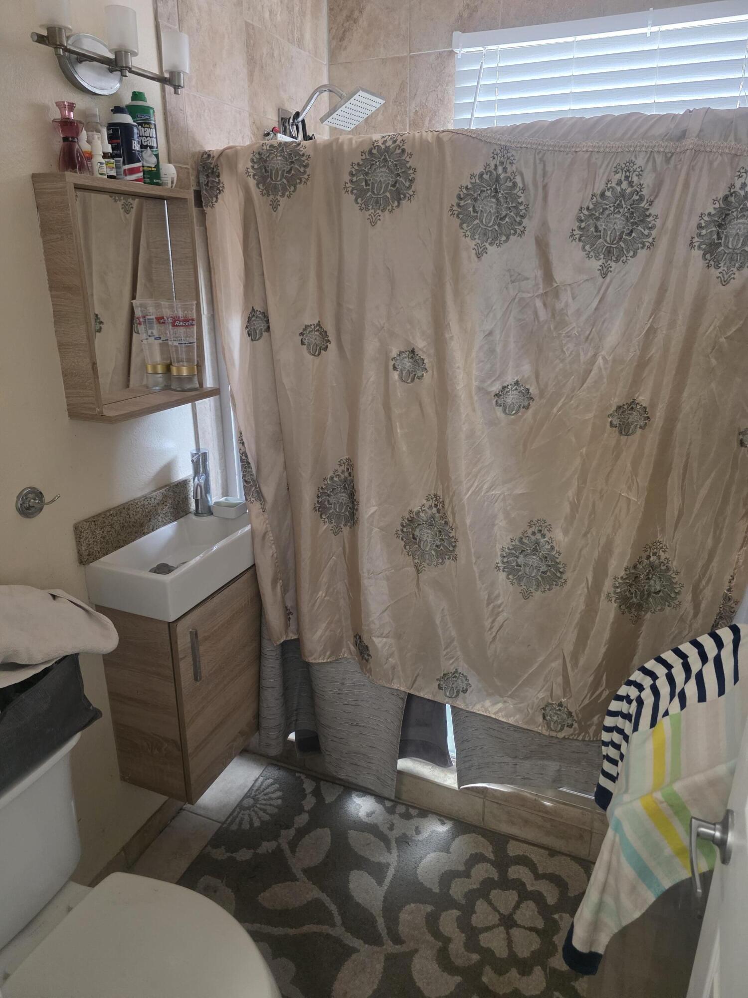 302 Lake Osborne Drive, Unit 4 Lake Worth Beach, FL 33461 - Photo 10 of 10 a bathroom with a sink and toilet