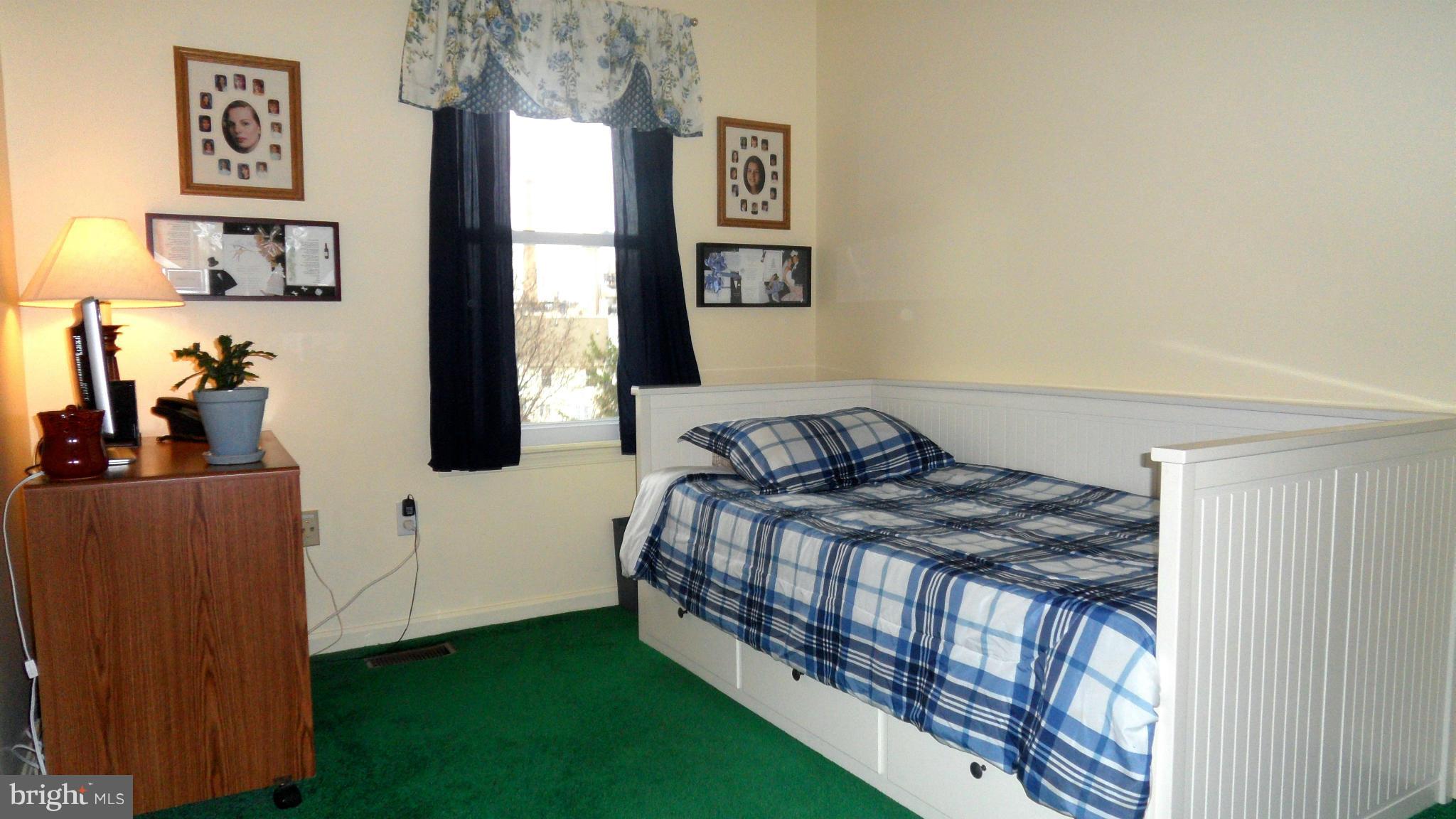 1209 Hilltop Road Curtis Bay, MD 21226 - Photo 16 of 24 a bedroom with a bed and a window
