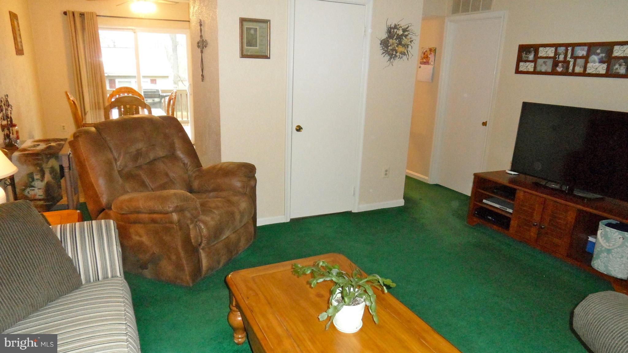 1209 Hilltop Road Curtis Bay, MD 21226 - Photo 3 of 24 a living room with furniture and a flat screen tv