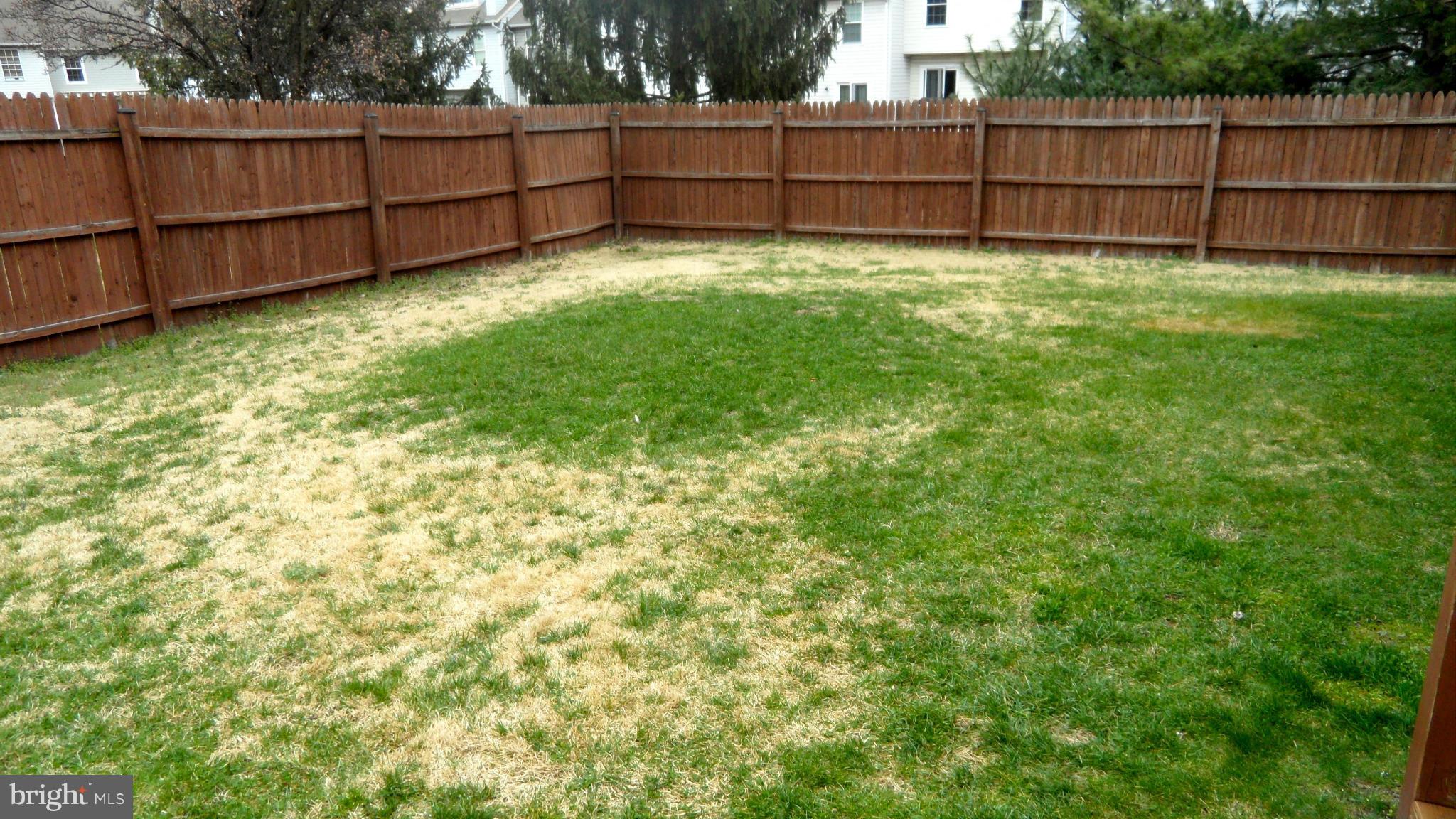 1209 Hilltop Road Curtis Bay, MD 21226 - Photo 22 of 24 a view of a backyard with a fence