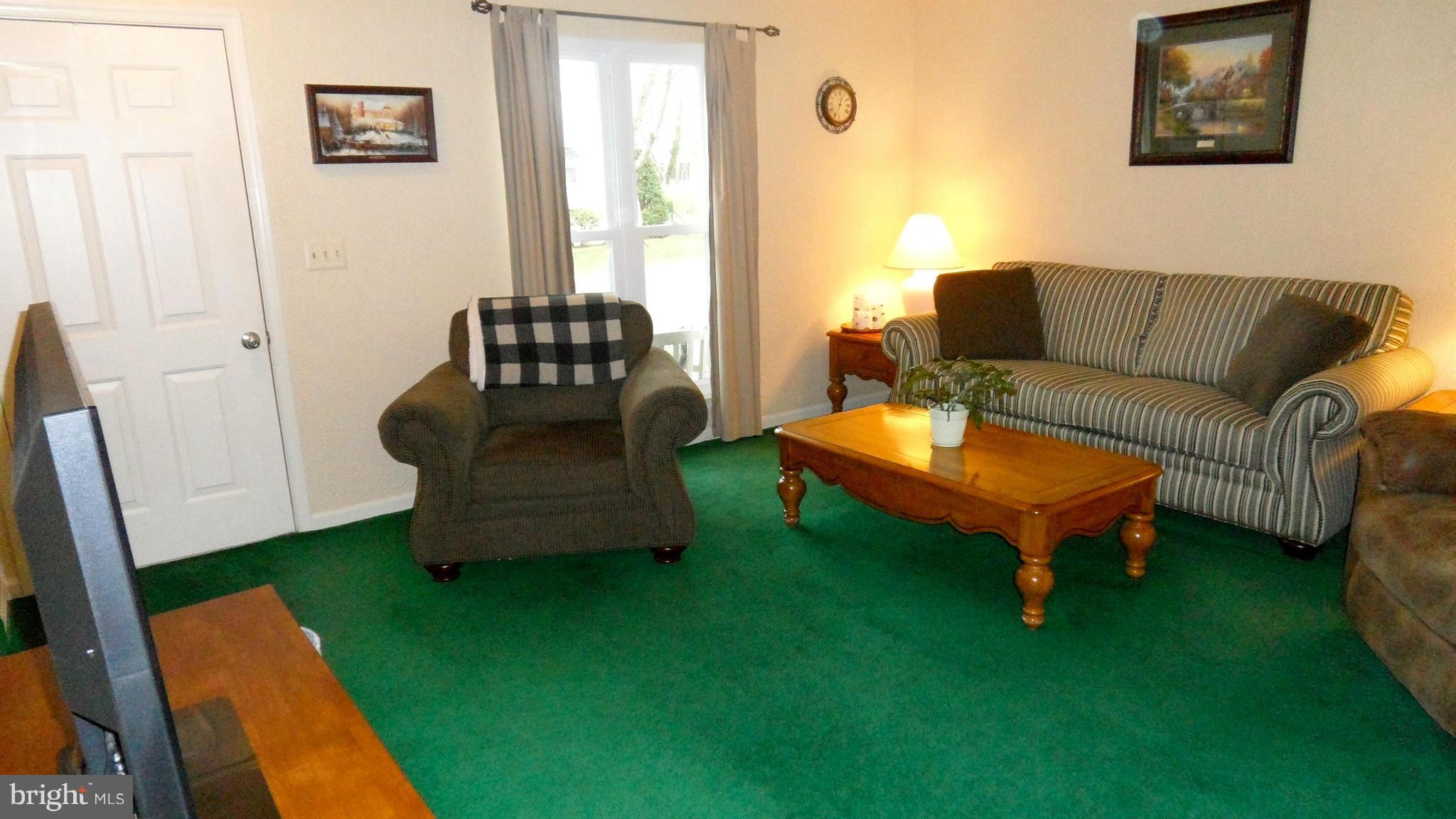 1209 Hilltop Road Curtis Bay, MD 21226 - Photo 4 of 24 a living room with furniture and a rug