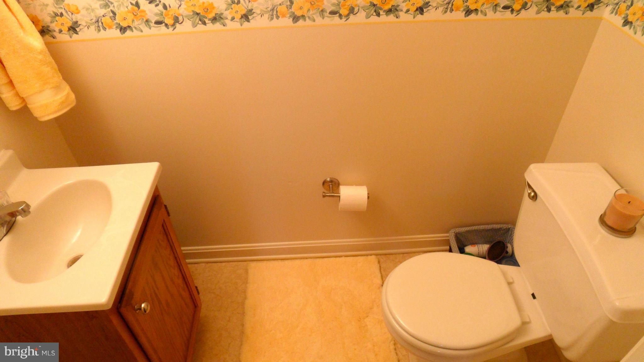 1209 Hilltop Road Curtis Bay, MD 21226 - Photo 10 of 24 a bathroom with a toilet and a sink