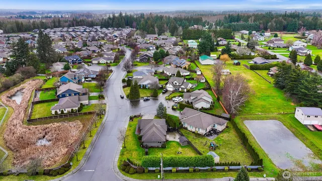 an aerial view of residential houses with outdoor space
