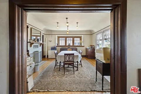 a view of a livingroom with furniture and a window