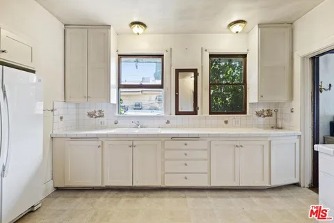 a view of a livingroom with furniture and window
