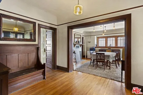 a view of a livingroom with furniture window and wooden floor