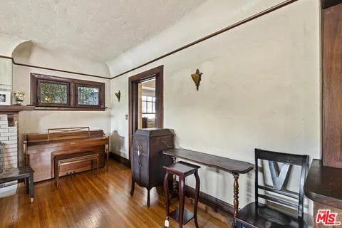a room with furniture and a wooden floor