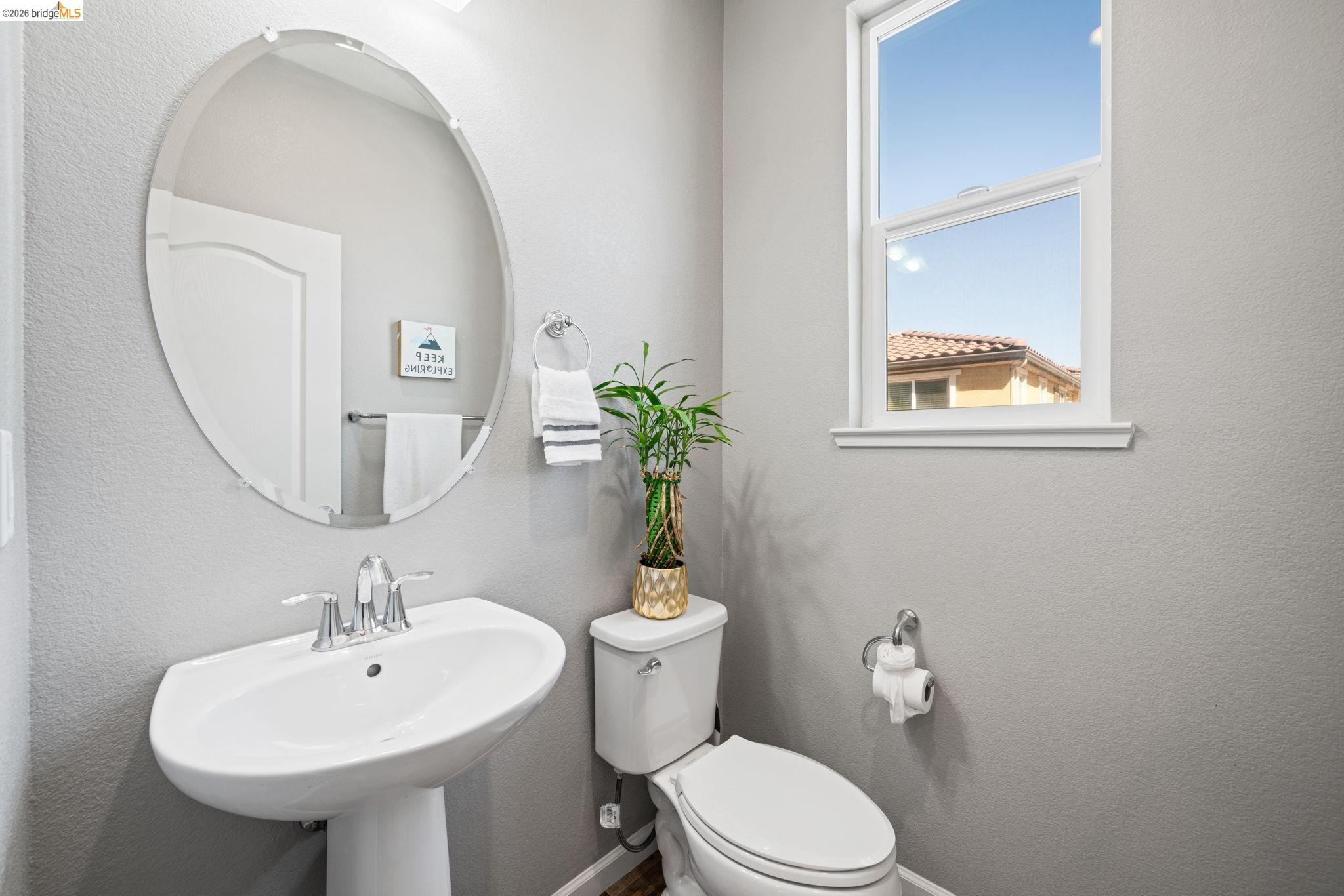 1280 Gusty Loop, Unit 4 Livermore, CA 94550 - Photo 13 of 40 a bathroom with a toilet sink and mirror