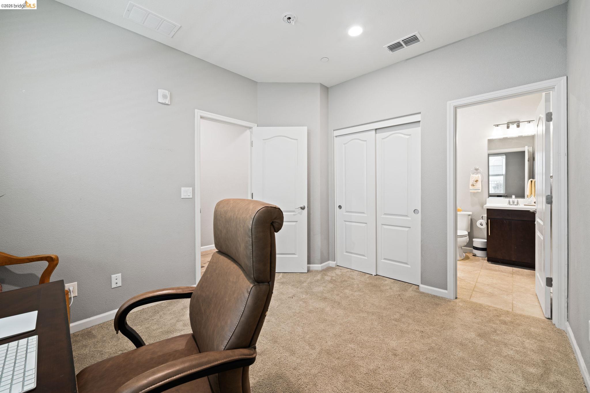 1280 Gusty Loop, Unit 4 Livermore, CA 94550 - Photo 22 of 40 a view of a hallway with closet and couch