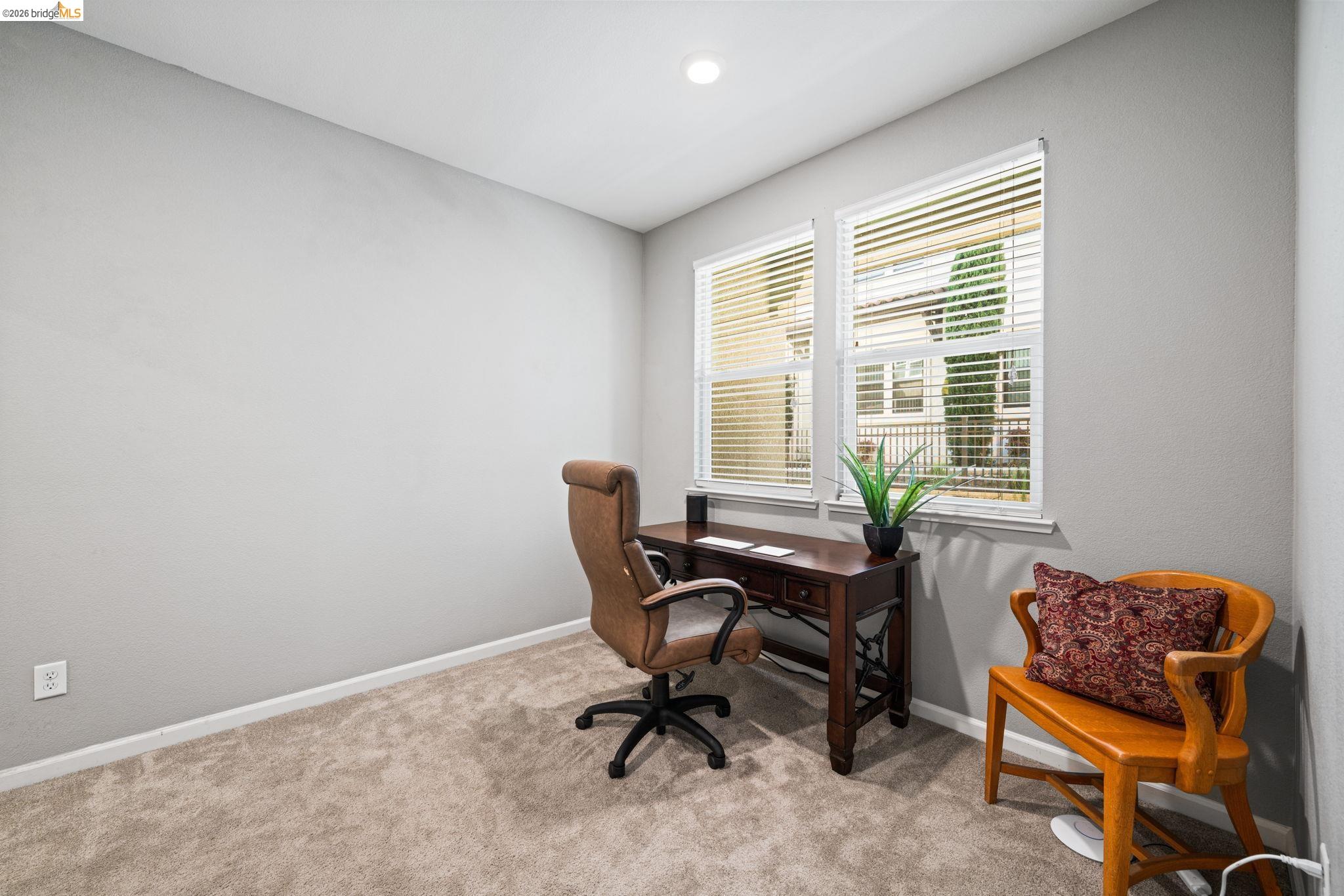 1280 Gusty Loop, Unit 4 Livermore, CA 94550 - Photo 23 of 40 a view of a workspace with furniture and a window