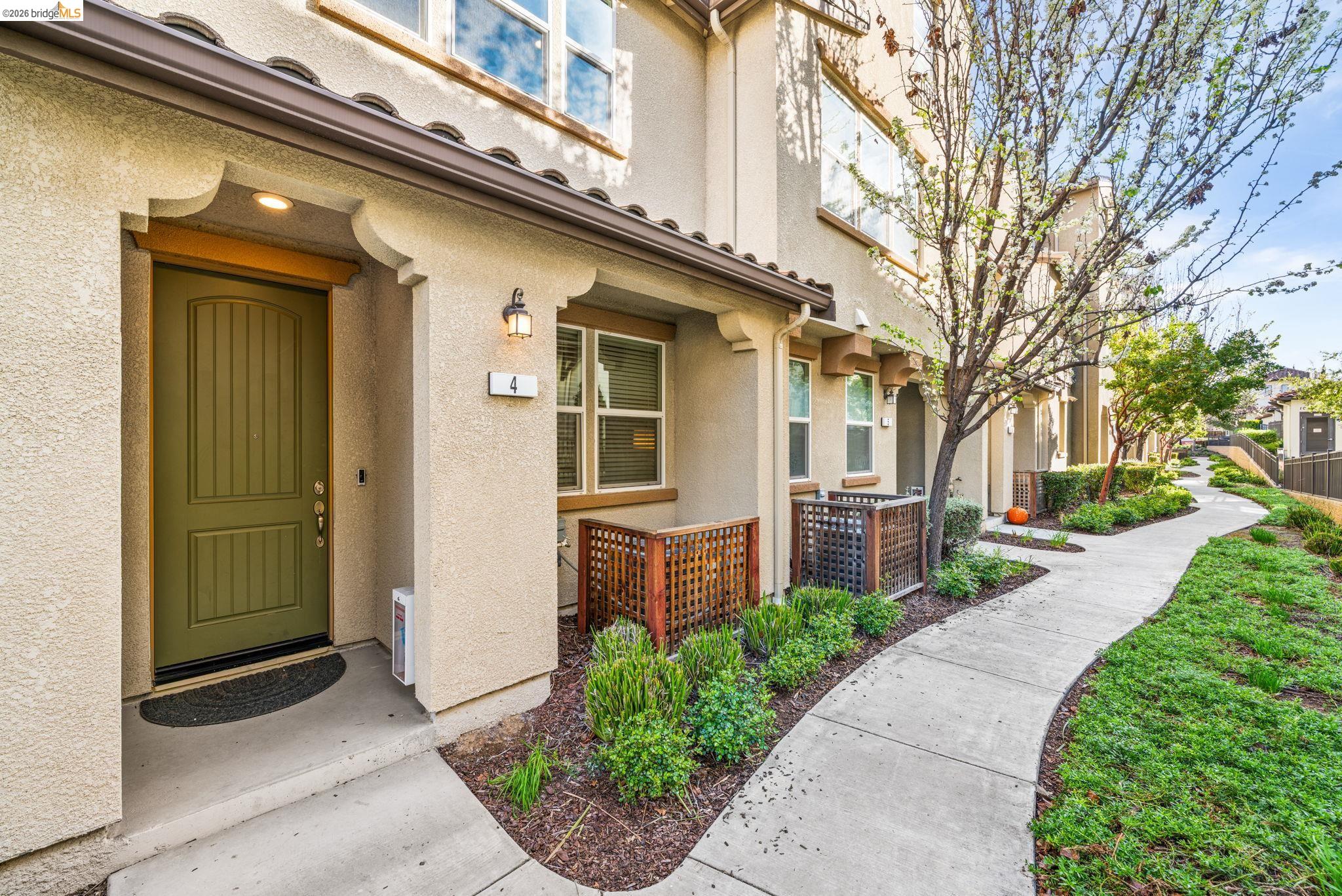 1280 Gusty Loop, Unit 4 Livermore, CA 94550 - Photo 29 of 40 a front view of a house with a garden