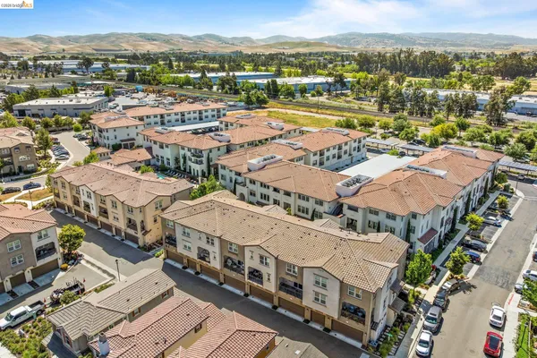 an aerial view of a city with lots of residential buildings