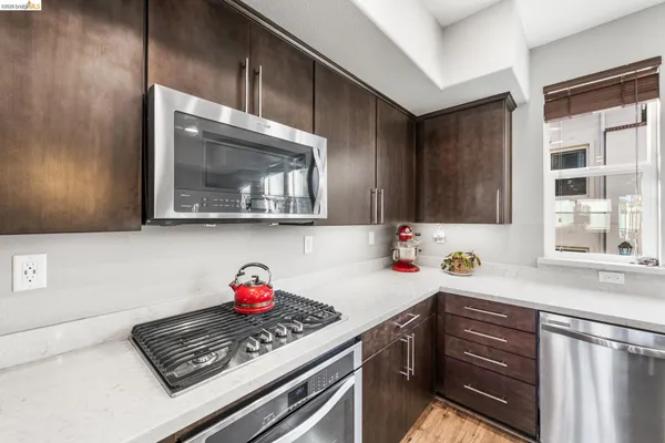 a kitchen with a sink cabinets and stainless steel appliances
