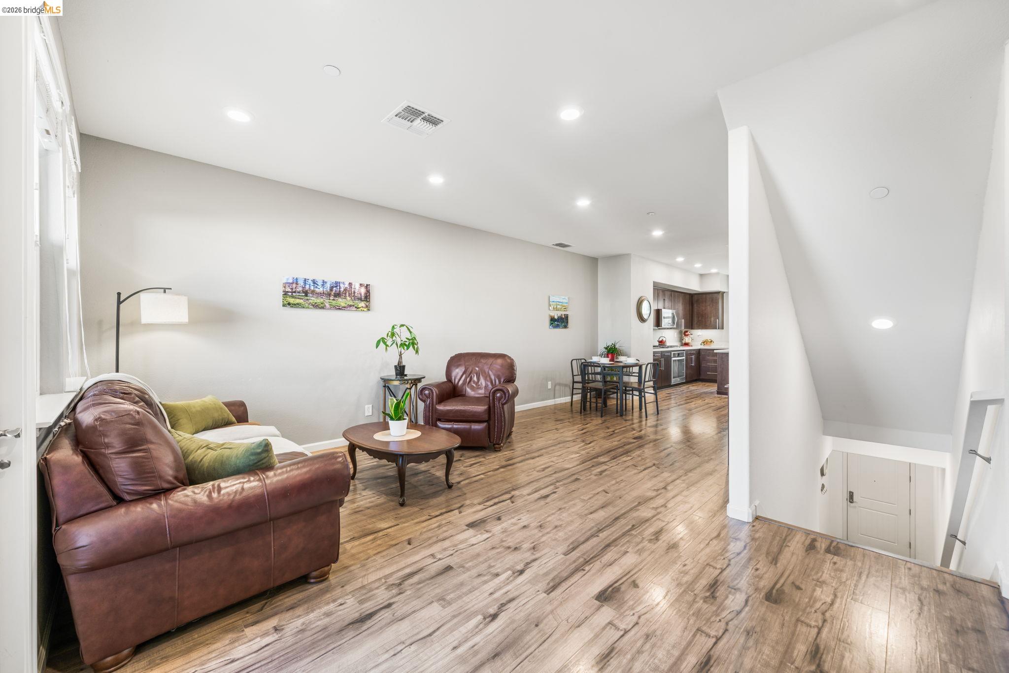 1280 Gusty Loop, Unit 4 Livermore, CA 94550 - Photo 7 of 40 a living room with furniture and wooden floor
