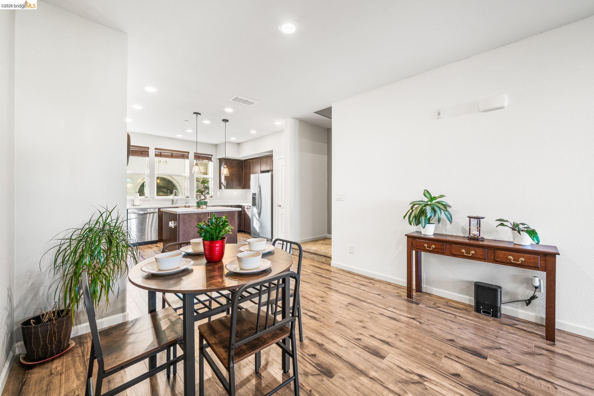 1280 Gusty Loop, Unit 4 Livermore, CA 94550 - Photo 10 of 40 a view of a dining room with furniture and wooden floor
