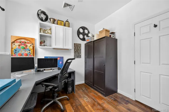 a view of workspace with wooden floor shelves