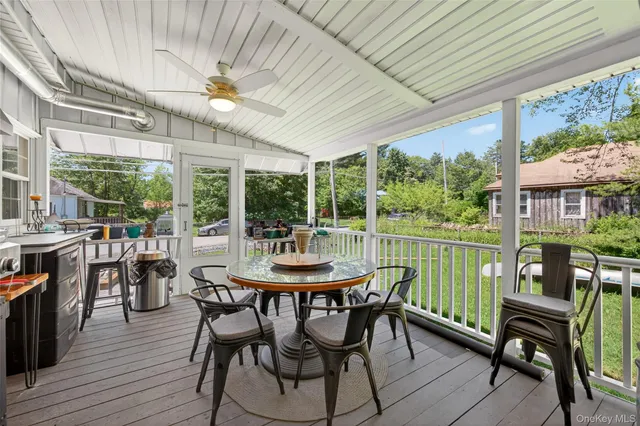 a dining room with furniture window and outside view