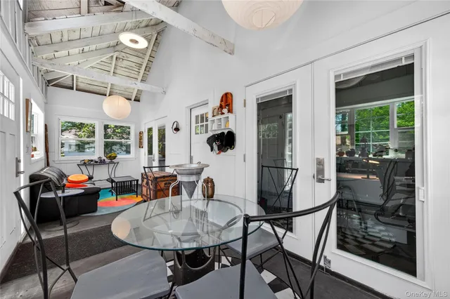 a dining room with furniture and window