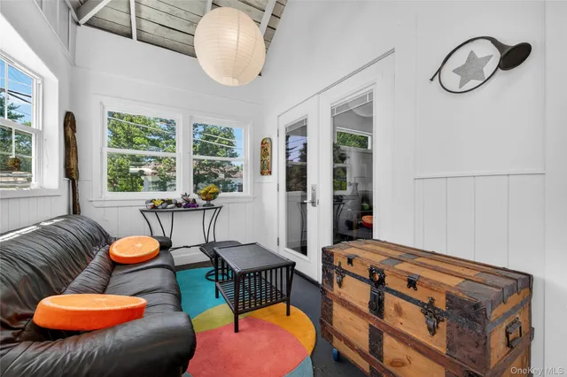 a living room with furniture fireplace and window