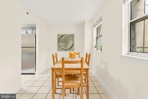 a view of dining room with furniture and wooden floor