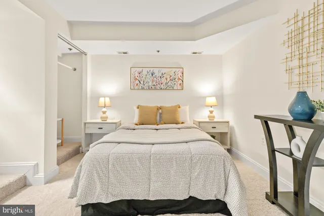 a bedroom with a bed and a table