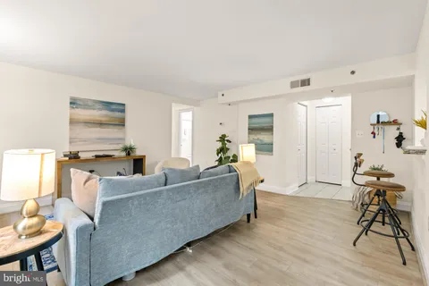a view of a dining room with furniture and a window