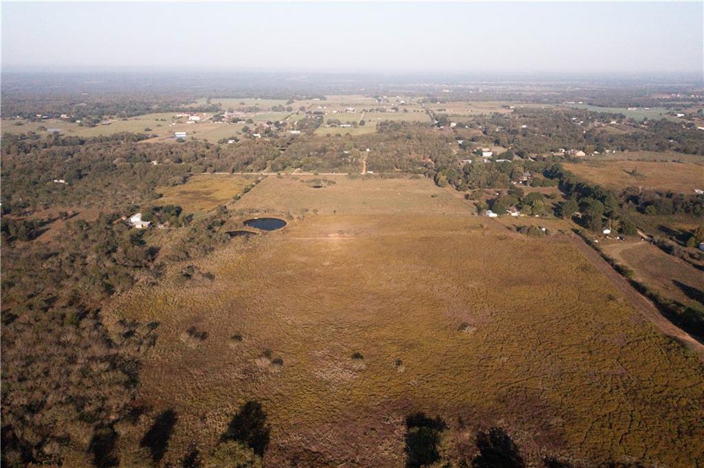 Undisclosed Address Elgin, TX 78621 - Photo 1 of 2 an aerial view of house with yard and mountain view in back