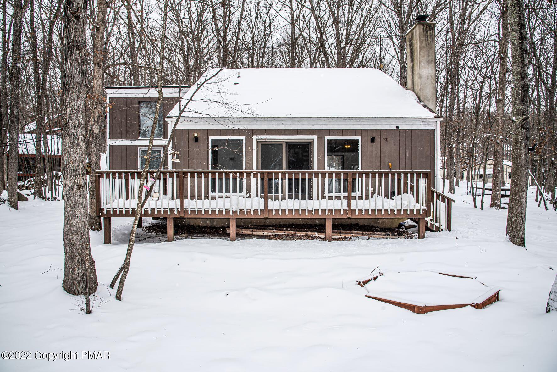 250 Canterbury Road Bushkill, PA 18324 - Photo 1 of 39 a view of a house with a yard and deck