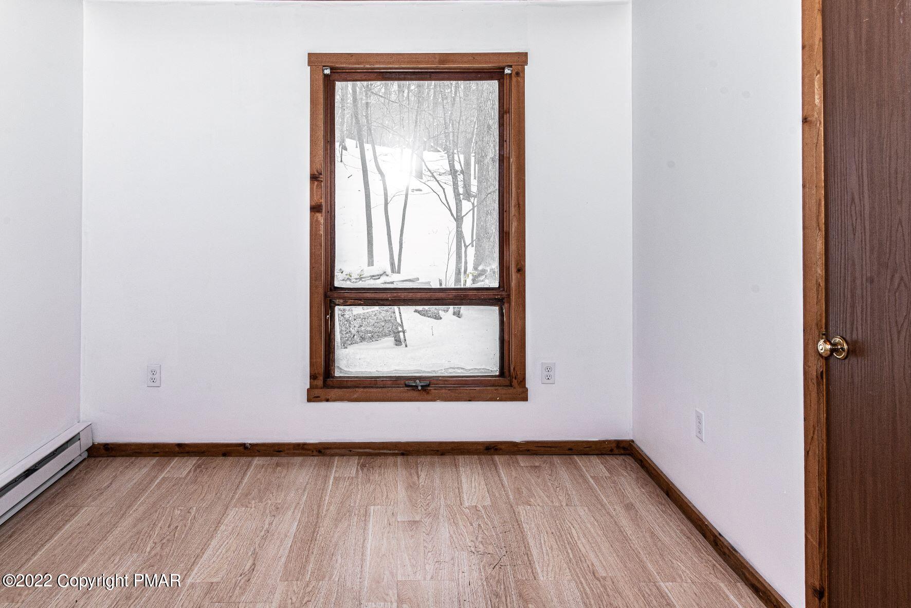 250 Canterbury Road Bushkill, PA 18324 - Photo 26 of 39 a view of a small space with wooden floor and a window