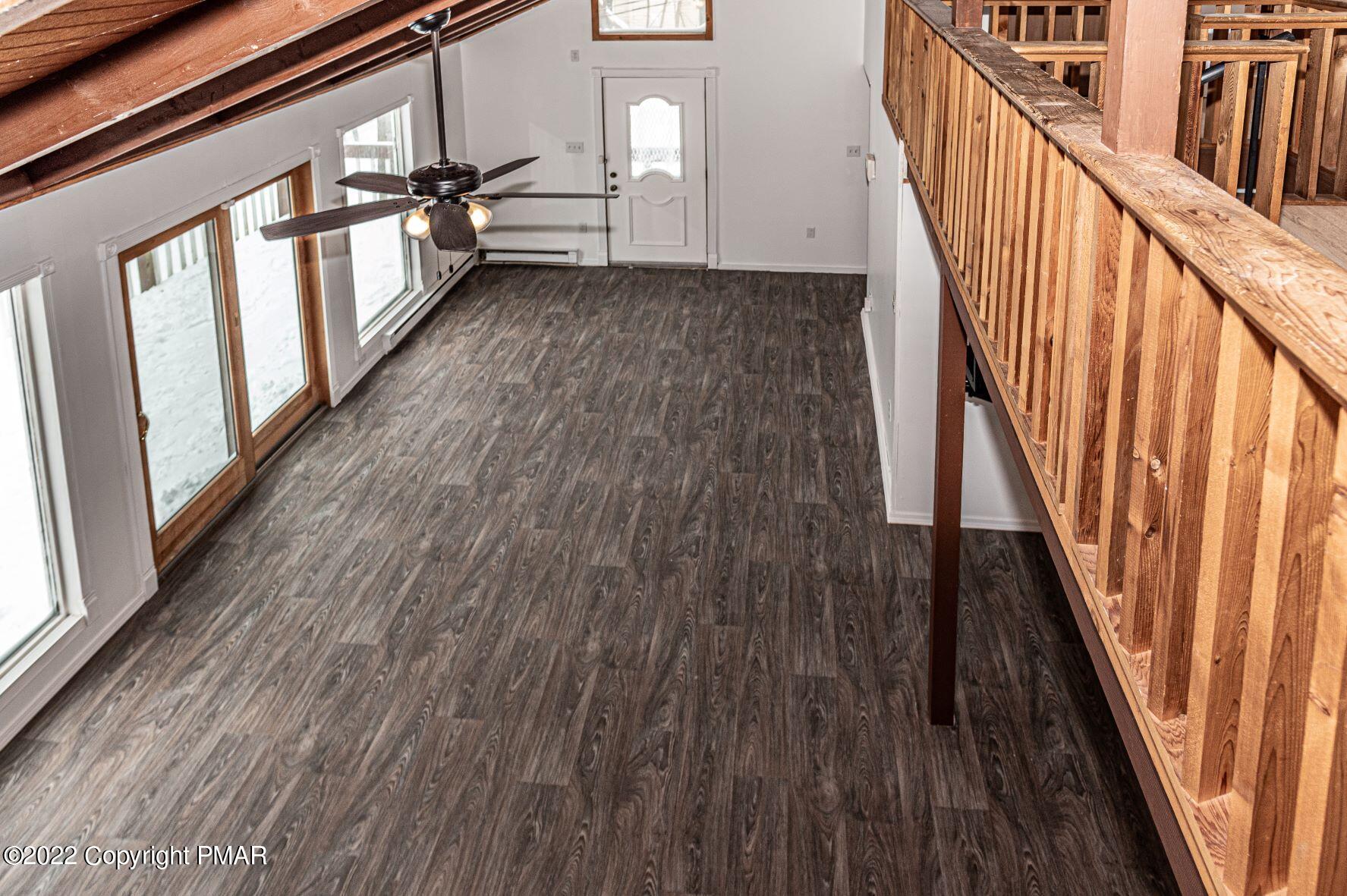 250 Canterbury Road Bushkill, PA 18324 - Photo 10 of 39 a view of a hallway with wooden floor and staircase