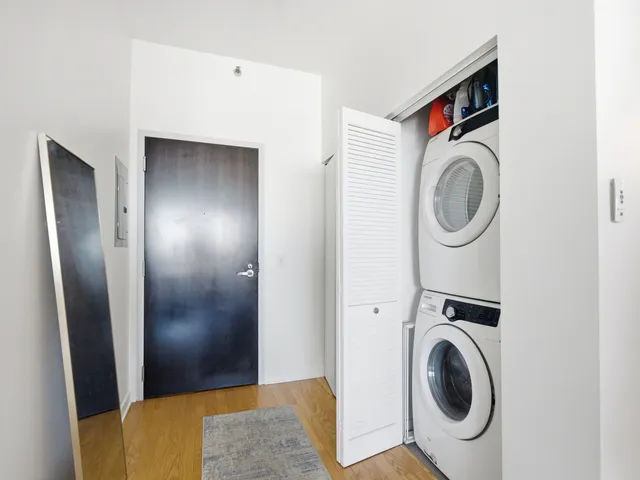 a view of a storage & utility room with washer and dryer