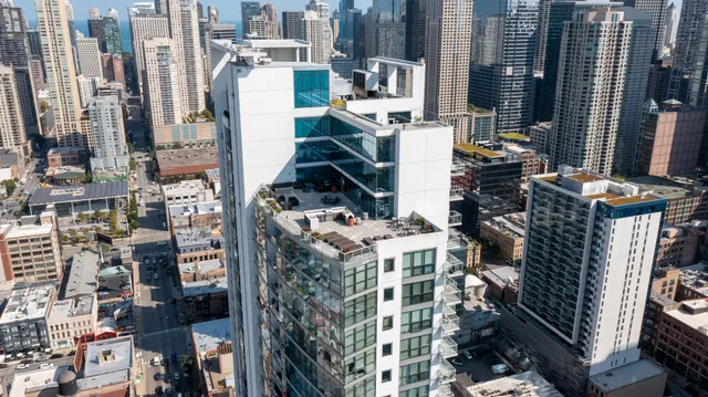 a view of a building with sitting area