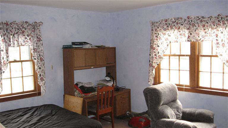 22 Stub Toe Road Cotuit, MA 02635 - Photo 12 of 16 a living room with furniture and a window