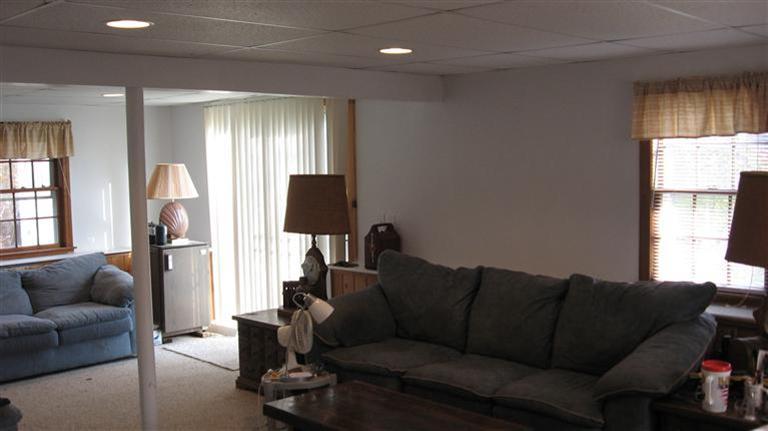 22 Stub Toe Road Cotuit, MA 02635 - Photo 16 of 16 a living room with furniture a window and a flat screen tv