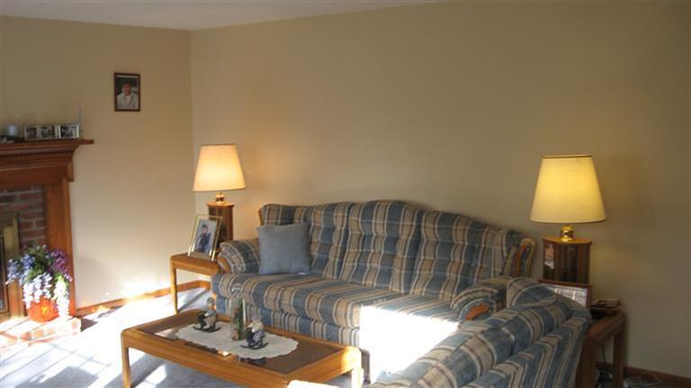 22 Stub Toe Road Cotuit, MA 02635 - Photo 7 of 16 a living room with furniture and a lamp