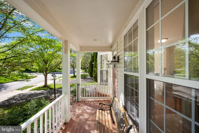 a view of a house with backyard and balcony