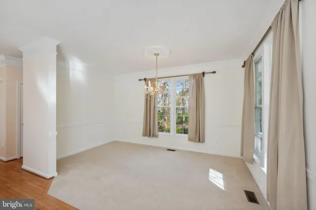 an empty room with windows and outdoor view