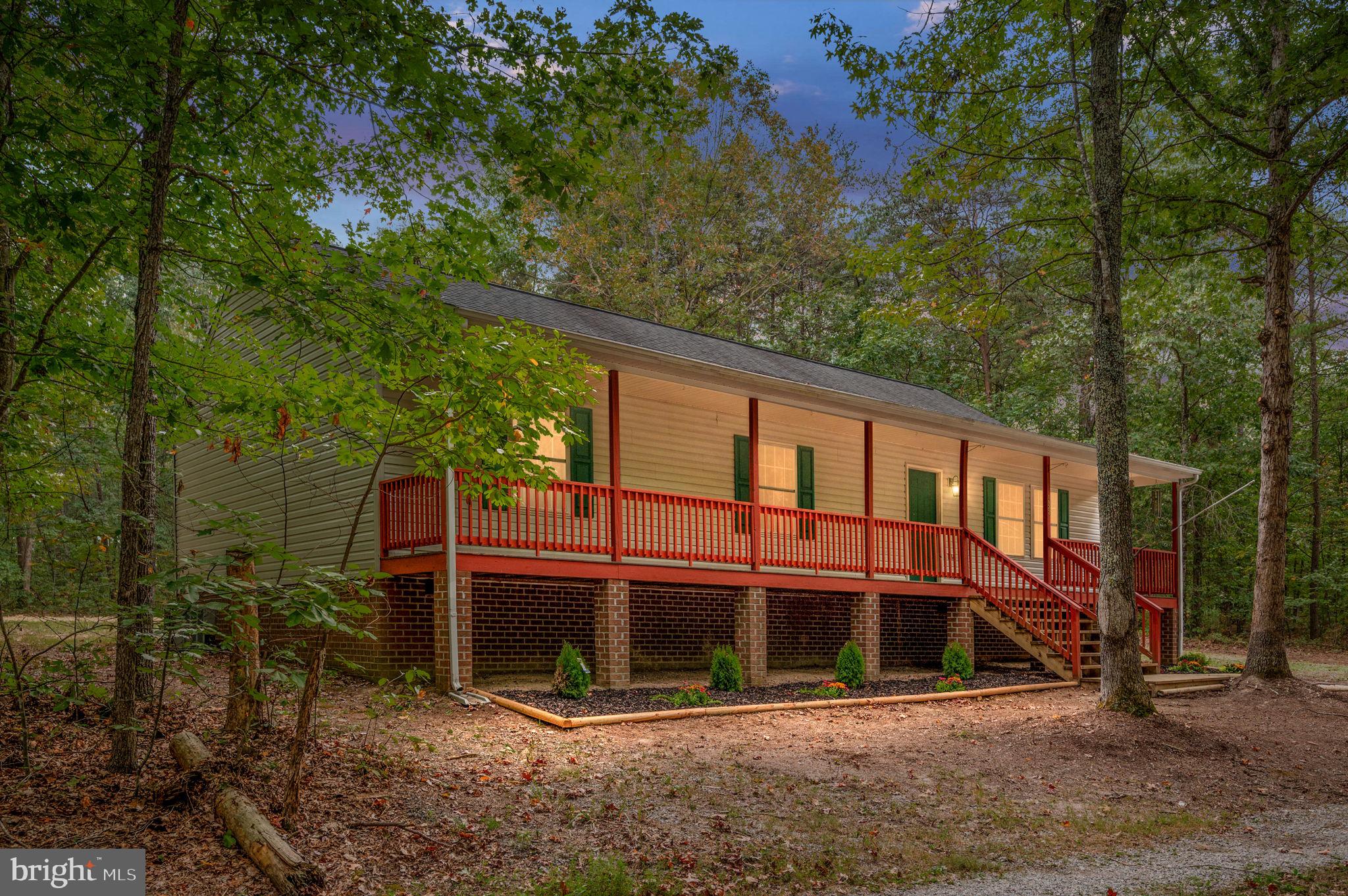 1822 Copper Line Road Bumpass, VA 23024 - Photo 1 of 65 a front view of a house with balcony