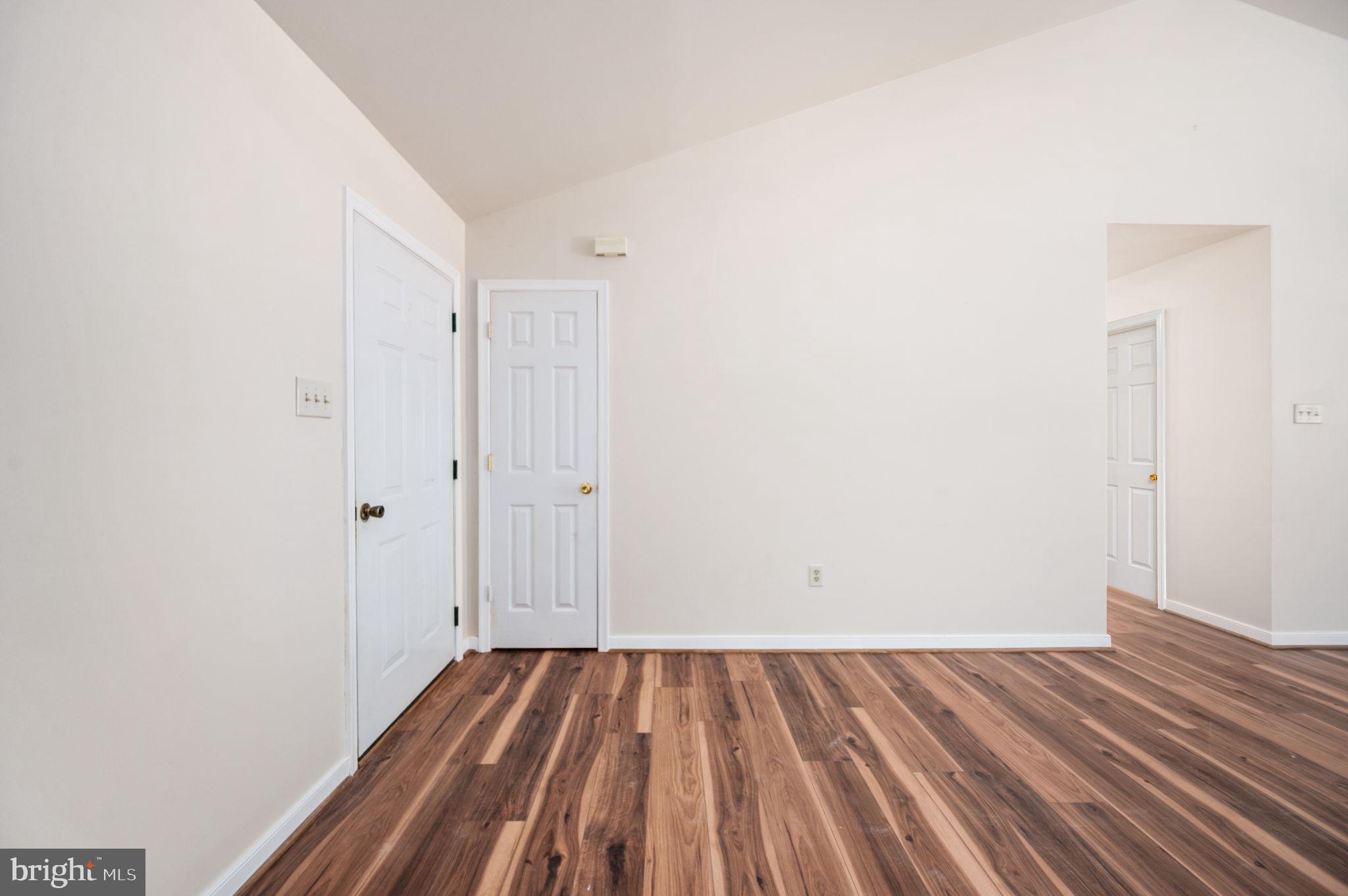 1822 Copper Line Road Bumpass, VA 23024 - Photo 14 of 65 a view of a room with wooden floor and bench