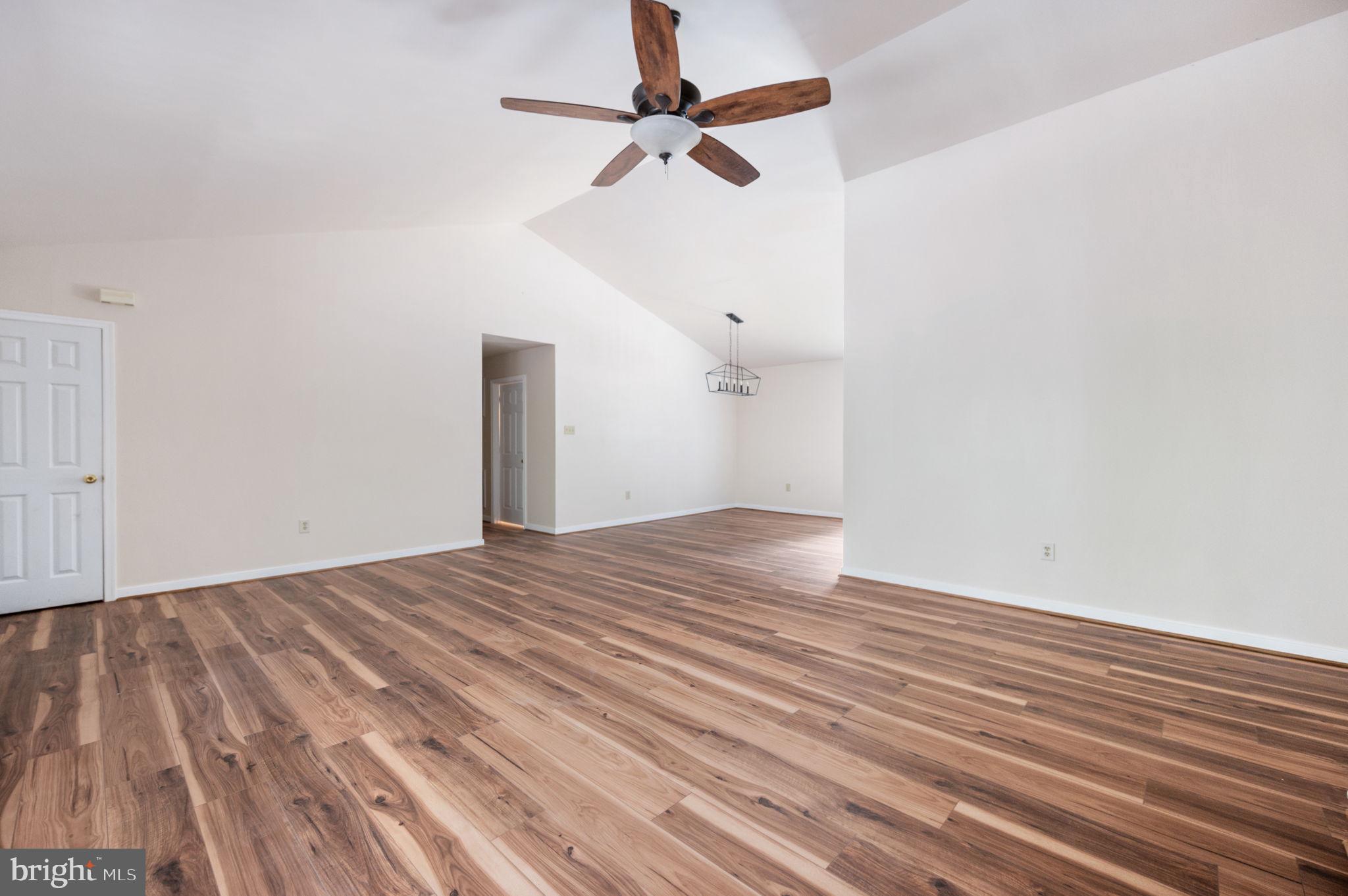1822 Copper Line Road Bumpass, VA 23024 - Photo 16 of 65 a view of empty room with wooden floor