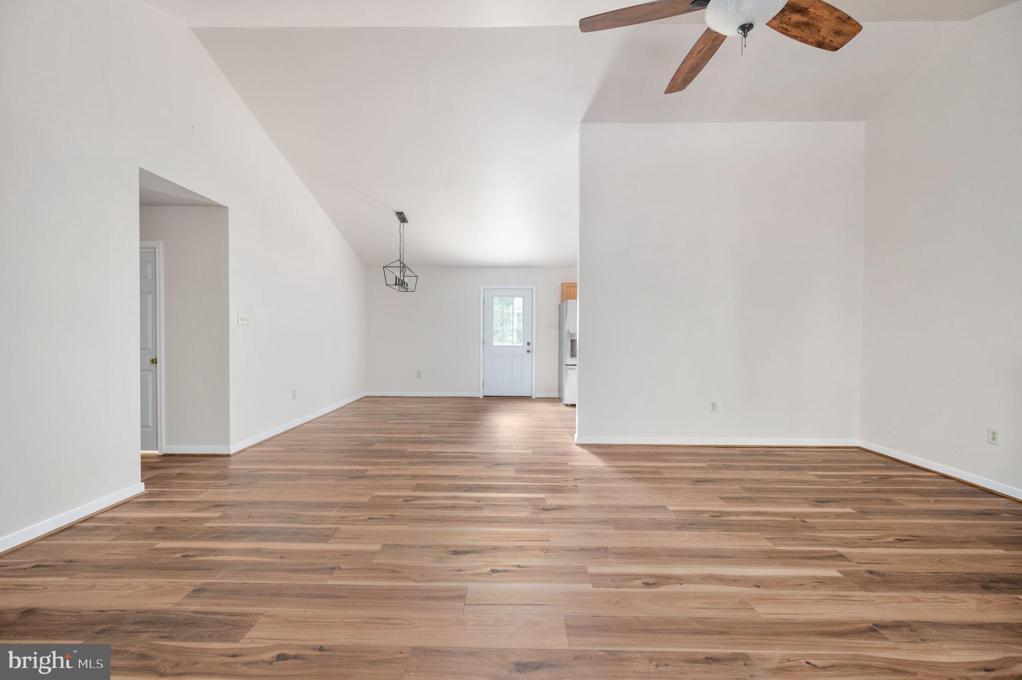 1822 Copper Line Road Bumpass, VA 23024 - Photo 17 of 65 a view of empty room with wooden floor