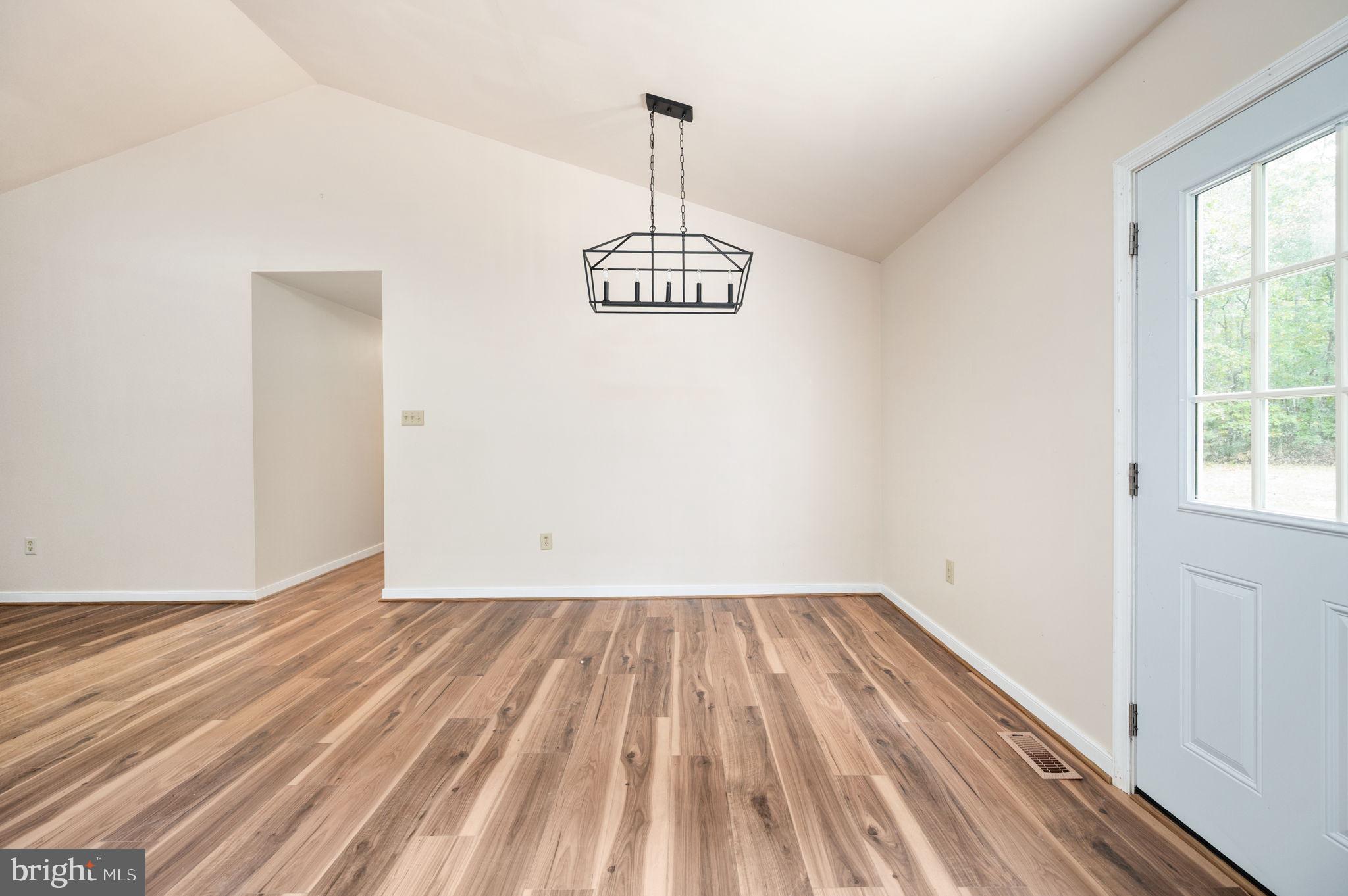 1822 Copper Line Road Bumpass, VA 23024 - Photo 19 of 65 a view of a room with wooden floor and window