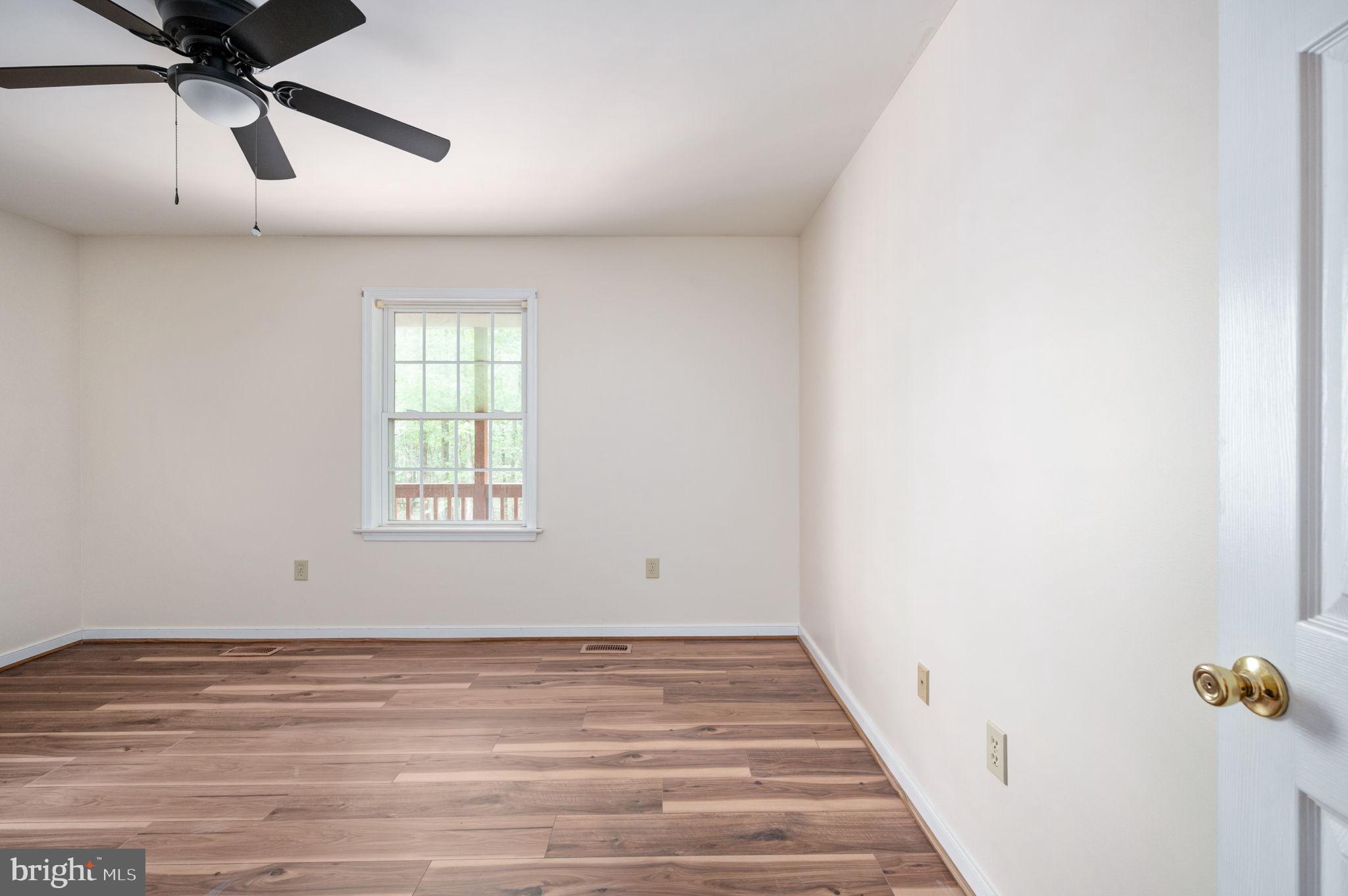1822 Copper Line Road Bumpass, VA 23024 - Photo 29 of 65 wooden floor in an empty room