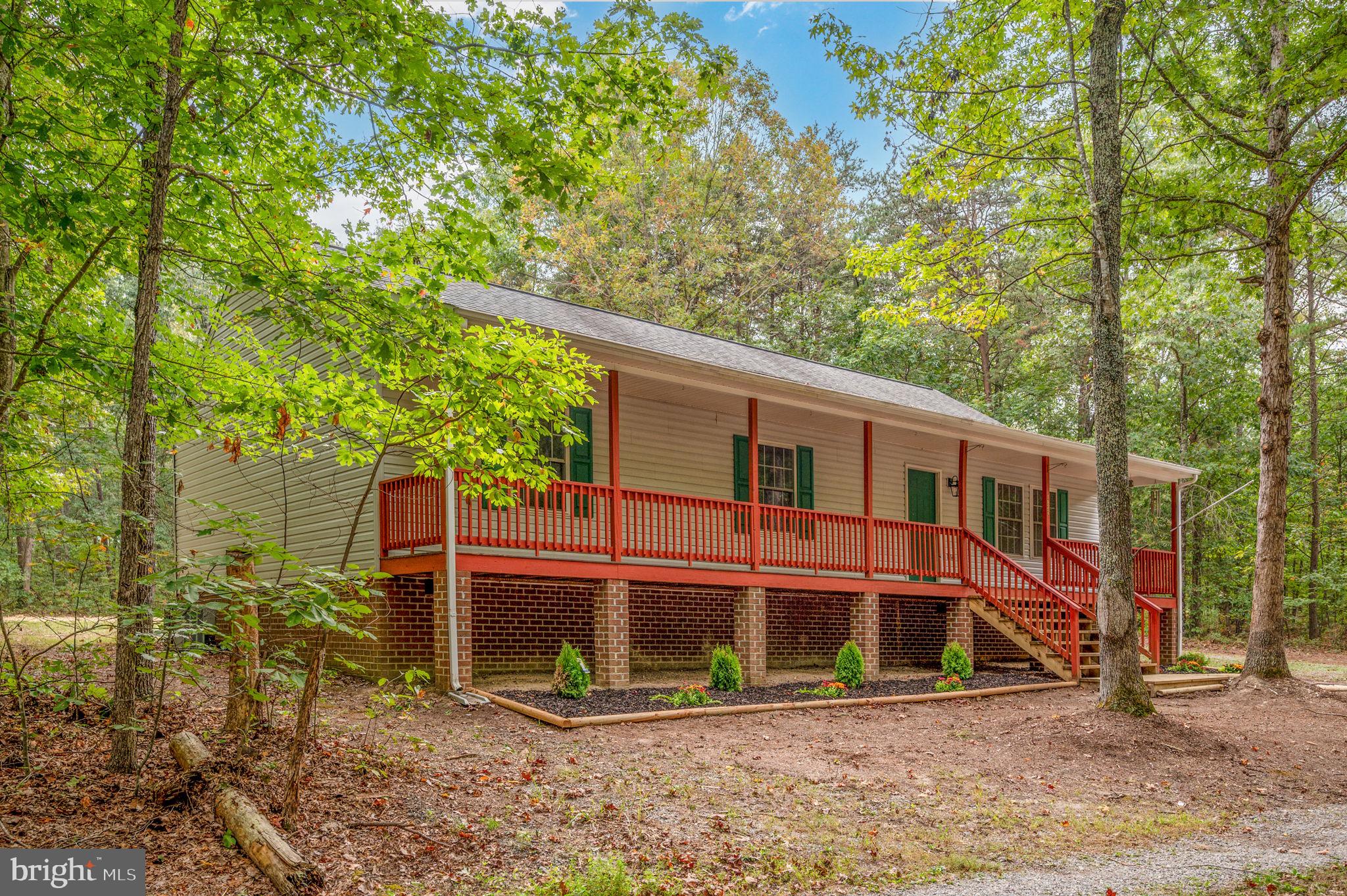1822 Copper Line Road Bumpass, VA 23024 - Photo 3 of 65 a view of a house with a yard and large tree